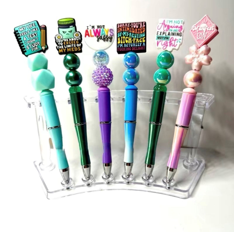 Decorative pens with beads or charms.